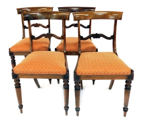 A set of four Edwardian dining chairs, each with a scroll and fan bar back, with drop in seats.