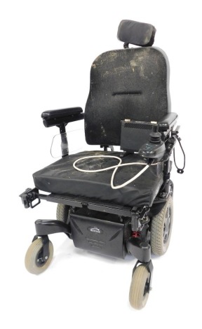 A Millbrook Healthcare Quickie upright electric wheelchair, with additional battery pack.