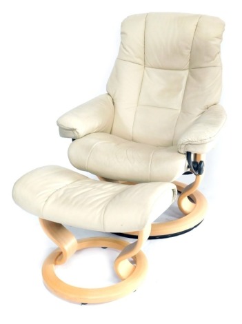 A Stressless cream reclining chair and footstool. (2)