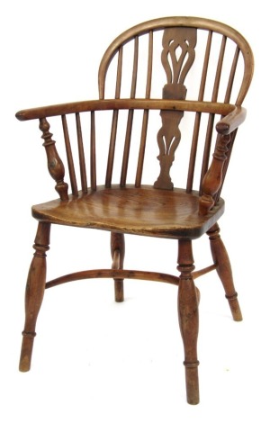 A 19thC yew ash and elm lot back Windsor chair, with crinoline stretcher.