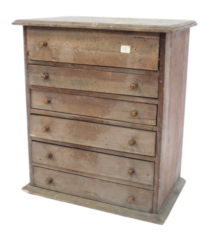 A pine apprentice chest, with an arrangement of six drawers, 43cm high, 39cm wide, 27cm deep.