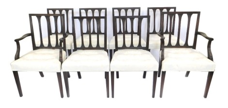 A set of eight 19thC mahogany dining chairs, each with a carved rail back, a button padded seat upholstered in cream damask, on square tapering legs, two with arms.