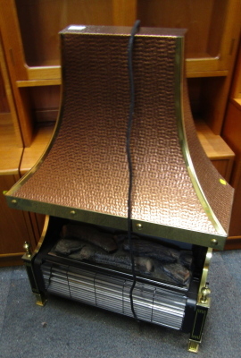 An electric fire, with hammered brass Arts & Crafts style out swept hood, 108cm high, 72cm wide.WARNING! This lot contains untested or unsafe electrical items.  It is supplied for scrap or re-conditioning only TRADE ONLY 