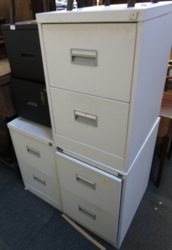 Three grey metal two drawer filing cabinets, 70cm high, 47cm wide, together with a black metal two drawer filing cabinet. (4)