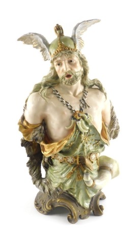 An Ernst Wahliss Austrian porcelain figural bust, modelled in the form of a soldier, wearing a hat with feathers, chain mail, sword, etc. on a rococo base embellished with flowers and berries, printed mark to underside and numbers, 48cm high. (AF)