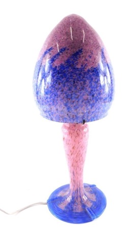 A Scottish style art glass table lamp and base, in the manner of Monart with mushroom shaped shade, baluster column and domed foot, 52cm high.