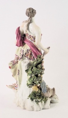 An 18thC Derby porcelain figure, modelled in the form of a lady holding a fish beside an urn, etc. on pierced rococo scroll base, 24cm high. - 2