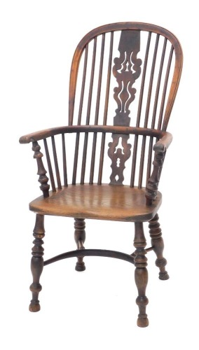 A mid 19thC yew, ash and elm high back Windsor chair, with a pierced splat, solid seat, on turned legs, with crinoline stretcher.