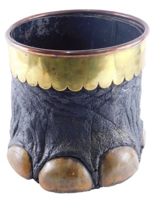 An Edwardian taxidermied elephants foot coal bucket, with a brass and copper petallated band and a metal liner, 31cm high.