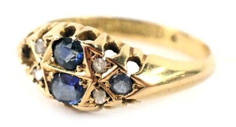 An 18ct gold gypsy ring, set with four oval sapphires (1 missing) and four tiny diamonds, each in claw setting, ring size K½, 2.6g all in.