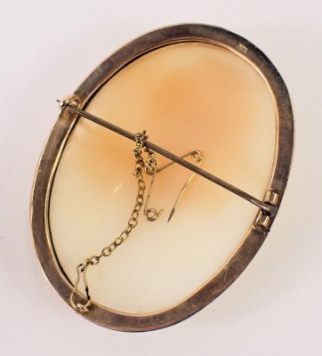 A 19thC shell cameo brooch, depicting maiden looking dexter, with rose design shoulder piece and dress, in a yellow metal rope twist outer framed border, with single pin back and safety chain, 6cm x 4cm, yellow metal unmarked, 16.3g all in. - 2