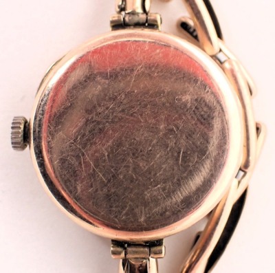 A 9ct gold cased Ingersoll ladies wristwatch, with a white enamel dial, on expanding bracelet, 2cm diameter, 11.9g all in. - 3