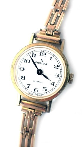 An Excalibur ladies wristwatch, in a gold plated case, with stainless steel back numbered 6002, on a plated bracelet.