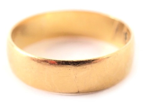 A 22ct gold wedding band, of plain design, ring size J, 2.6g.