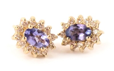 A pair of tanzanite and diamond cluster earrings, 7cm high, yellow metal back with single pin back and butterfly backs, stamped 750, 2g all in, boxed.