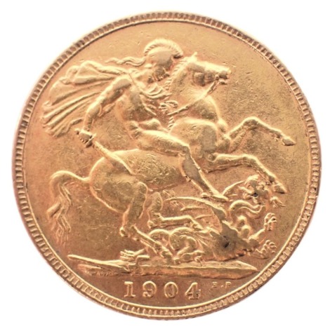 An Edward VII full gold sovereign dated 1904.