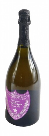 A bottle of special edition Andy Warhol Dom Perignon vintage 2002 champagne, with purple label, from the Andy Warhol Tribute Collection, 30cm high.