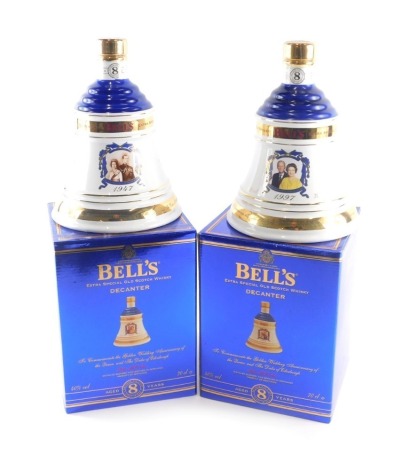 Two bottles of Bell's Extra Special Old Scotch whisky, to commemorate the Golden Wedding Anniversary of the Queen and Duke of Edinburgh, in blue boxes.