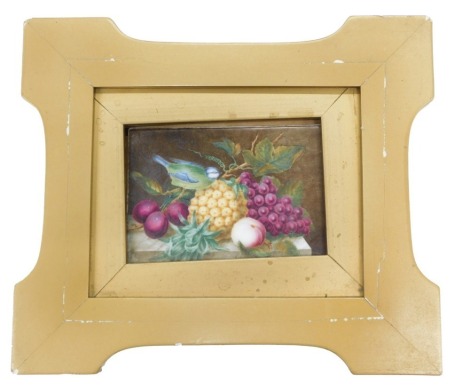 A late 19thC Derby porcelain plaque, painted with still life of fruit and a blue tit, etc., inscribed to reverse 'painted on china by George Complin, Derby, before 1794', the plaque approx 6cm x 8.5cm.