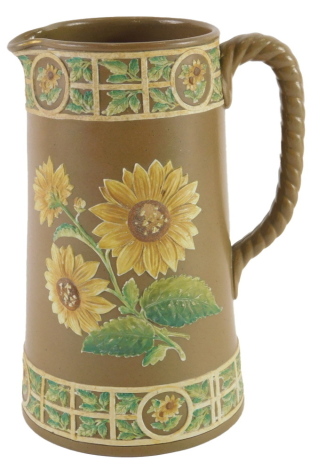 A Victorian basalt relief moulded jug, decorated with sunflowers, etc., registration mark and indistinct numbers to underside, 19cm high.