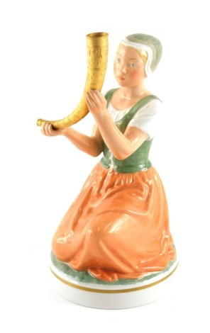 A Royal Copenhagen Danish figure, of Kristina Svendsdatter, carrying gilded horn, numbered 12242, 21cm high.