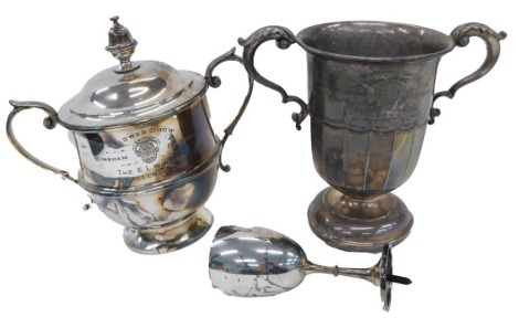 Three silver plated trophies, comprising a Bingham Branch Flower Show silver plated trophy and cover, 24cm high, a Bingham Flower Club trophy lacking base, 20cm high, and a small trophy cup for The British Legion, 15cm high. (3)