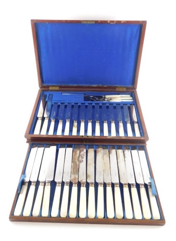 A set of silver plated and mother of pearl table knives, dessert knives etc.