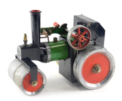 A scale live steam model of a traction engine, painted in black, green and red, possibly Mamod but unmarked, 22cm long.