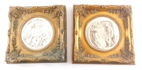 Two similar marble effect resin plaques, each modelled in the form of figures within a gilt frame, 30cm wide.