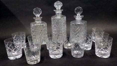 Two similar square section decanters, each with faceted stopper, another similar with canted corners, and various cut glass tumblers.