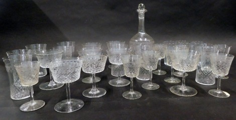 An early 20thC engraved part suite of glasses, to include decanter, tumblers, wine glasses, etc., some pieces associated.