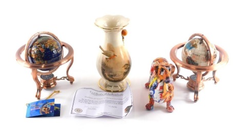 A collection of items, to include a dachshund with graffiti style decoration, two small globes, and a Treasury of Nature Bradford Exchange vase. (4)