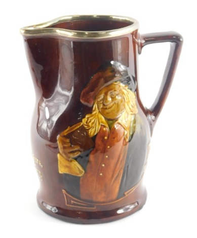 A Royal Doulton whisky jug, decorated with a figure with a book, and with raised slipware motto Thou Other's Purses Be More Fat, Why Should We Pine or Greave for That Hang Sorrow! Care Will Kill a Cat and Therefore Let's Be Merry, silver mounted rim, prin