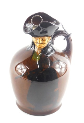 A Royal Doulton whisky flagon, the top moulded with a figure, the base printed with a similar figure holding a weapon, printed marks to underside, registration number 436947, 21cm high.