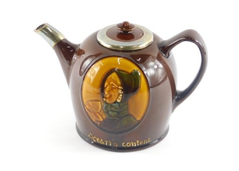 A Royal Doulton ceramic teapot and cover, the lid and spout with hallmarked silver border, the base impressed with a lady holding a teacup with motto Hert's Content, printed marks to underside.