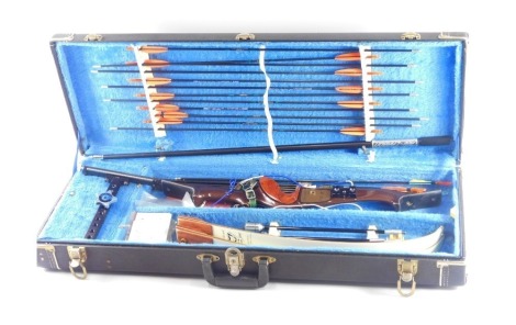 An archery set, comprising a Portland carbon fibre bow stamped 84009, 64.32X26, various arrows, etc.