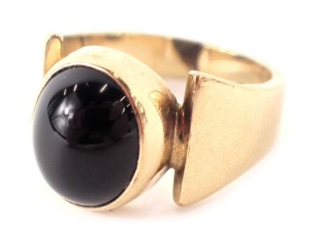 A 9ct gold signet ring, with a polished black agate centre, ring size N½, 5.8g all in.