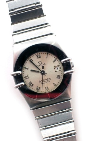 An Omega constellation ladies wristwatch, the stainless steel casing with silvered numeric dial with date aperture, the deposee model numbered 6051-013, the dial 2.5cm wide.