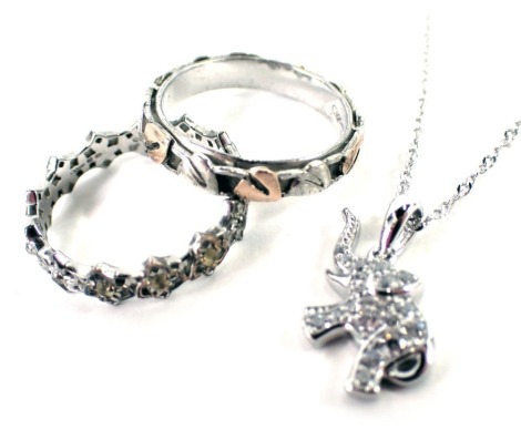 Three items of jewellery, comprising two dress rings, one of leaf and flower design, white metal stamped 925, 4.5g all in, and a white metal and CZ set elephant pendant and chain, stamped 925. (3)