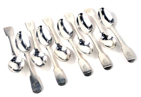 A matched set of ten silver fiddle pattern teaspoons, maker IW, inscribed F, various years circa George V, 7.35oz.