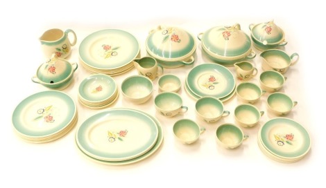 A Susie Cooper part dinner and tea service, printed and painted with flowers within green bands, stamped underside Susie Cooper Production, Crown works Burslem, pattern number 1009-20 etc.