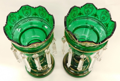 A pair of Victorian green tinted glass table lustres, each decorated in raised enamels and gilt with flowers, shields etc. on a domed foot, 36cm high. - 2