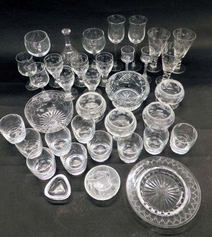 A quantity of engraved glass, to include examples decorated with flowers, a finger bowl and stand, a set of three matching pedestal salts, a Lalique style jar lid, decorated with dragonflies etc.