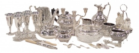 A large quantity of silver plate, to include an engraved late Victorian jug with cover, three piece tea set with part fluted decoration, circular tureen, three branch candelabra, part cruet, etc.