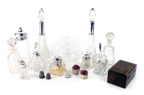 A collection of dressing table items, to include a pair of cut glass and silver mounted scent bottles, two bone pin cushions, a banded agate, seal etc.