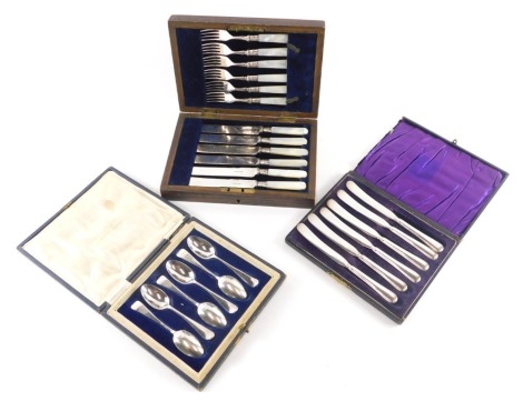 A set of six silver teaspoons, in fitted case, 3.06oz, a set of mother of pearl handled and silver plated dessert knives and forks, and a set of six dessert knives.