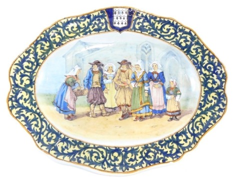 A 19thC Porquier Beau oval Faience platter, La Sortie D'eglise mark to underside in blue with title and monogram, 35cm wide.