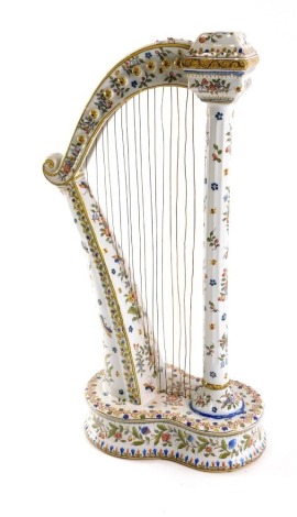 A 19thC French faience large harp, by Fourmaintraux Freres, possibly produced in Northern France, marked II to underside, with copper strings, 44cm high.