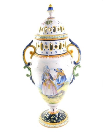 A 19thC French faience HB Quimper lidded vase, with potpourri top in the Bretonne and Botanical pattern, signed HB Quimper, 46cm high.