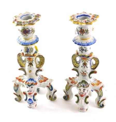 A pair of 19thC French faience candlesticks, of Desvres Griffin form, Fourmaintraux region, 24cm high.